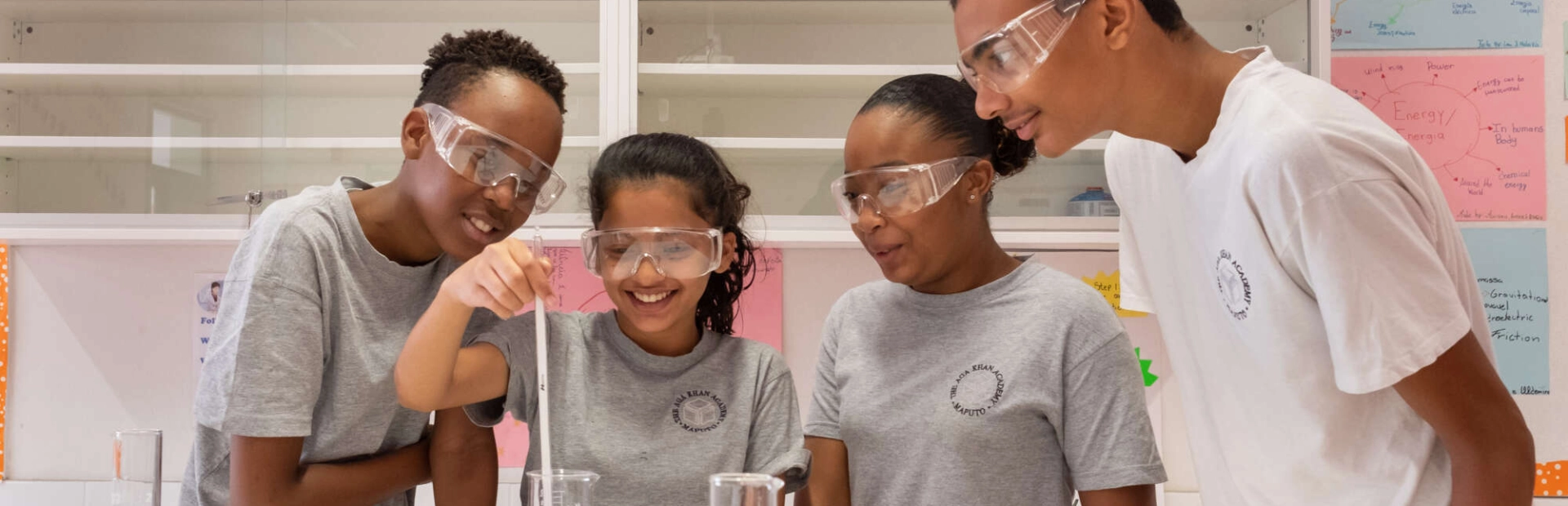 AKA Maputo students working on a science experiment in their classroom. 